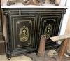 A late 19th century French brass inlaid ebonised marble top side cabinet W.125cm                                                       