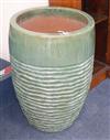 A large green glazed ribbed garden planter H.68cm                                                                                      