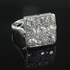 A 1940's/1950's platinum and nine stone diamond set tablet ring, size N.                                                               