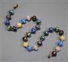 An early 20th century Venetian? cane glass bead necklace, with yellow metal spacers and clasp inscribed 1910, 47cm.                    