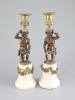 A pair of 19th century bronze and ormolu figurative candlesticks, 33cm high.                                                                                                                                                
