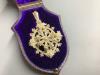 A 19th century seed pearl pendant, 55 mm, in fitted box.                                                                                                                                                                    