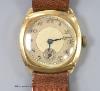 A gentleman's 1930's 9ct gold Huba manual wind wrist watch, with leather strap, case diameter 29mm, gross weight 26.2 grams.                                                                                                