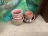 Seven various terracotta garden planters, largest 40cm diameter                                                                                                                                                             