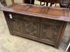 An 18th century style carved oak panelled coffer, width 105cm depth 45cm height 58cm                                                                                                                                        