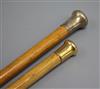 An 18ct gold topped walking stick and a silver topped walking stick                                                                    