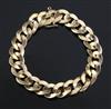 An 18ct gold flat curb link bracelet, 46.3 grams.                                                                                      