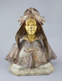 Henry Jacobs. An Art Nouveau gilt bronze bust of a medieval maiden, height 14in., on associated marble plinth                          