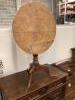 A George III faded oak circular tilt top tea table, 68cm diameter, height 72cm                                                                                                                                              