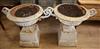 A pair of Victorian cast iron urns on plinths H.79cm                                                                                   