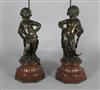 A pair of Victorian bronze figures of putti, H. 23.5in.                                                                                