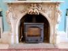 An important mid 19th century Italian white Carrara marble chimney piece, carved in the rococo taste, with seated putti, foliage swags                                                                                      