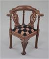 Denis Hillman. A George II style carved mahogany miniature corner armchair, height 3 1/8ins.                                           