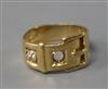 An early 20th century 18ct gold, ruby and diamond set buckle ring, size K.                                                             