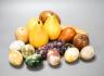 A group of polished stone and wood models of fruit, eggs, et.                                                                                                                                                               
