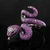 A modern blackened? gold, diamond and ruby encrusted serpent ring, size N.                                                             