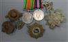 Two WWII service medals and six cap/tunic badges                                                                                       