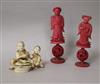 Two carved stained ivory chess pieces and ivory figurative group                                                                       