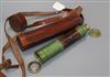 A leather cased three draw telescope                                                                                                   