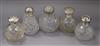 Five assorted Late Victorian and later silver topped cut glass scent bottles largest 13.4cm.                                           