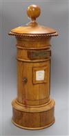 A golden oak pillar box height 63cm                                                                                                    