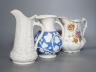 A Samuel Alcock relief-moulded jug, 20cm, and two other jugs                                                                                                                                                                