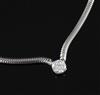 A white metal and single stone diamond set chain and snakelink, choker necklace, 40cm.                                                 