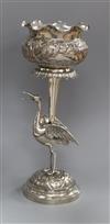 An Indian embossed white metal vase, with stork stem, 23.8cm.                                                                          