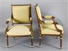 A pair of Louis XVI style parcel gilt carved walnut fauteuil, W.2ft 1in. H.3ft 1in.                                                    