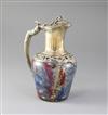 A French 950 standard silver gilt mounted coloured crackle glass claret jug, 22cm.                                                     