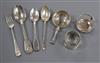 Four assorted silver teaspoons, a silver tea strainer on stand and a silver napkin ring.                                               