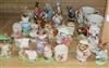 A quantity of Beatrix Potter figures, Royal Albert and Beswick with two Royal Doulton mugs and a similar figure 'Little Ballerina'     