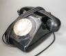A black Bakelite telephone                                                                                                                                                                                                  
