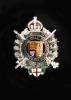 A white and yellow gold, diamond and polychrome enamel set London Rifle Brigade Sweetheart’s brooch                                                                                                                         