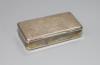 A 19th century continental white metal rectangular snuff box (a.f.)                                                                                                                                                         