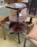 A George III mahogany circular three tier dumb waiter, diameter 60cm, height 108cm                                                                                                                                          