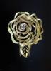 A 1980's French Cartier textured 18ct gold and diamond set 'open rose' clip brooch                                                                                                                                          