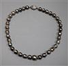 A modern single strand baroque cultured Tahitian? pearl choker necklace with a 14kt white gold and diamond set clasp, 40cm             