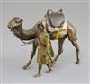 A late 19th / early 20th century Austrian cold painted bronze model of an Arab warrior walking alongside his camel, 6in.               