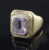 A 1970's high carat gold and amethyst? set Bishop's ring, size T/U.                                                                    