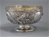 An early 20th century Chinese white metal pedestal bowl, embossed with dragons, 13.5 oz.                                               