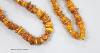 A single strand amber pebble necklace, 98cm, gross 56 grams.                                                                                                                                                                