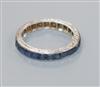 A white metal and sapphire set full eternity ring, size G.                                                                             