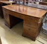 An Edwardian satinwood banded mahogany bow front kneehole pedestal desk, width 137cm, depth 76cm, height 74cm                                                                                                               