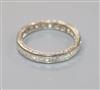 A white metal and square cut diamond full eternity ring, size I.                                                                       