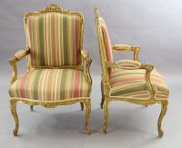 A pair of French gilt beech fauteuils, W.2ft 3in. D.2ft 1in. H.3ft 5in.                                                                