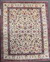 A Kashan ivory ground carpet, 14ft 3in by 10ft 7in.                                                                                    
