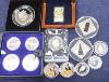 A group of silver proof coins, to include a JVP boxed orthodox shines $2, a Masterpieces of Art Cook Islands $20, a set of 1976 Montréal Olympics coins, a Cook Islands $5, three half ounce silver proof coins, a Niue Isla