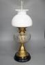 A brass oil lamp with opaque shade 60cm total height                                                                                                                                                                        