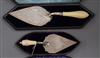 Two cased ivory handled silver trowels including Victorian, Sheffield, 1886, largest 37.5cm.                                           